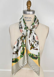 Front view of a luxury, bespoke Elwyn New York silk scarf wrapped around the neck of a form with a geometric butterfly vintage modern style print