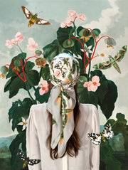 Classic Female standing in a fantastical, lush garden among the butterflies, wearing a luxury, bespoke Elwyn New York silk scarf on her head with a geometric butterfly vintage modern style print