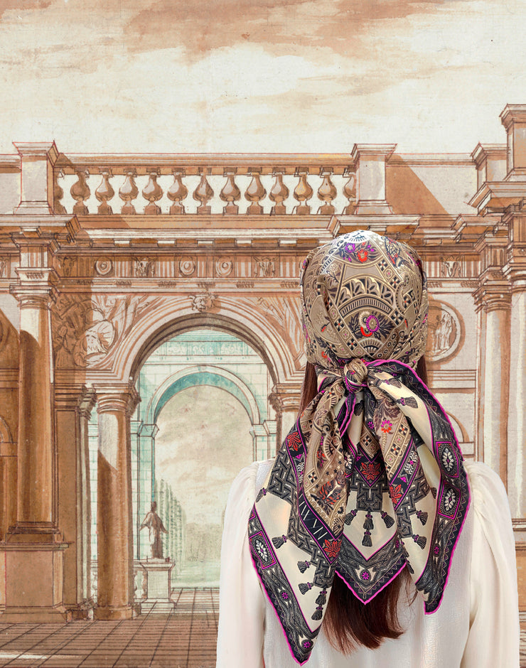 A classic model wearing a silk scarf tied around her head with a midnight garden print. 
