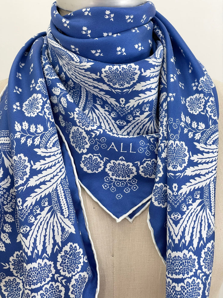 closeup of a personalized bespoke Elwyn New York Scarf around the neck of a form with an ornate, blue and white, vintage-pastoral bandana design. Classic, feminine, and romantic