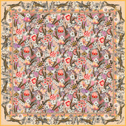 This Italian silk scarf is rich with sunset colored wildflowers and energized leopards romping around the border. 