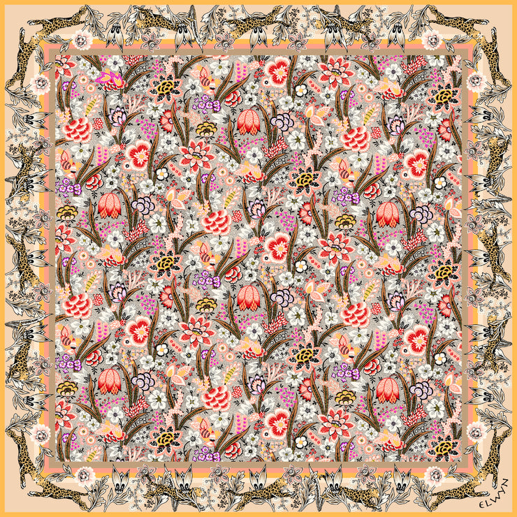 This Italian  silk bandana is rich with sunset colored wildflowers and energized leopards romping around the border.  The main print is dappled with tiny little dots better known in the textile world as "Picotage"