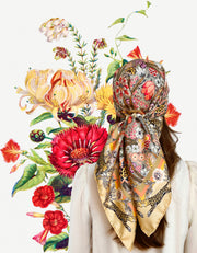 A classic model wearing a silk scarf around her head that is rich with sunset colored wildflowers and energized leopards romping around the border. 